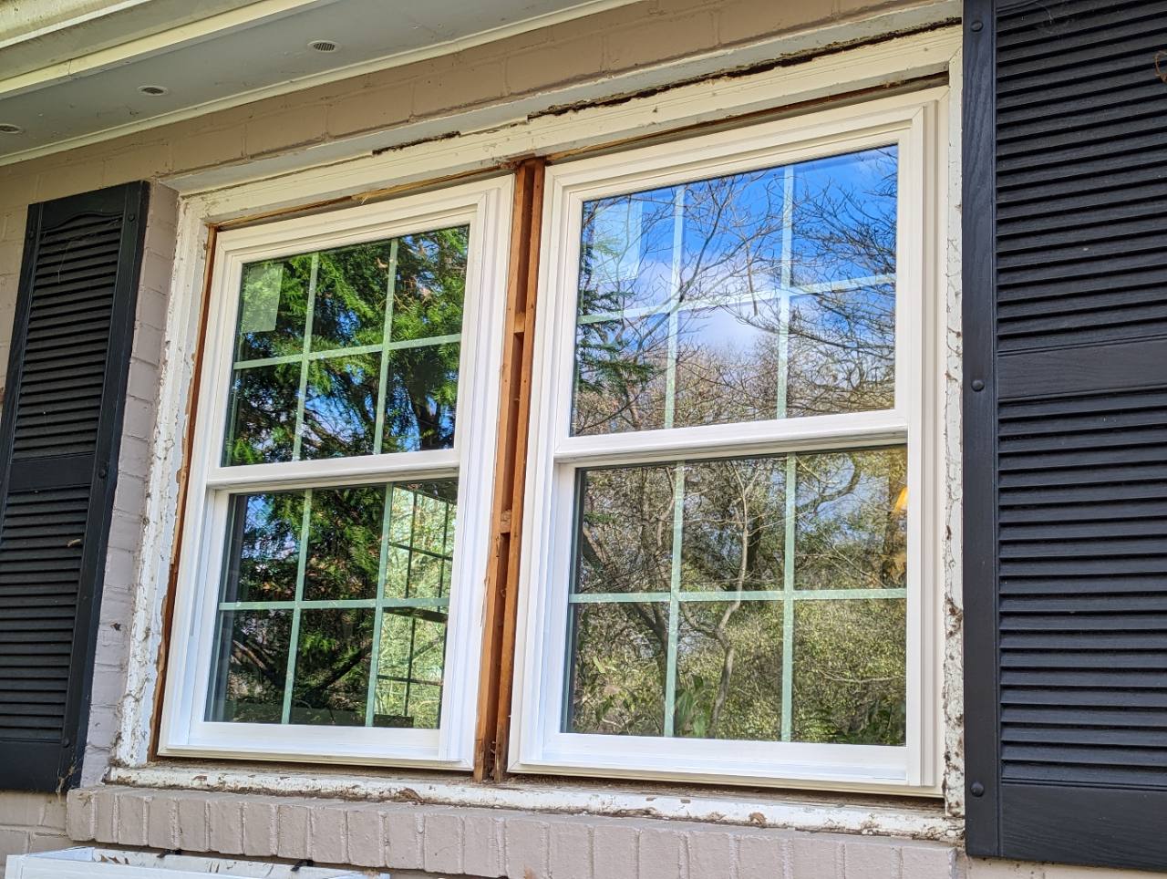 Two newly installed Vytex double-hung windows before Hallmark completed the exterior trim