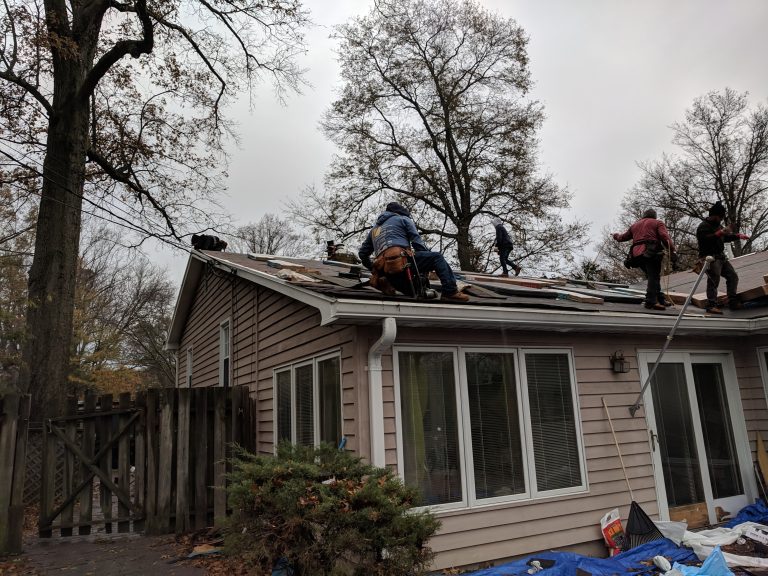 Next Day Roofing crew working on a roof at a Columbia, Maryland home