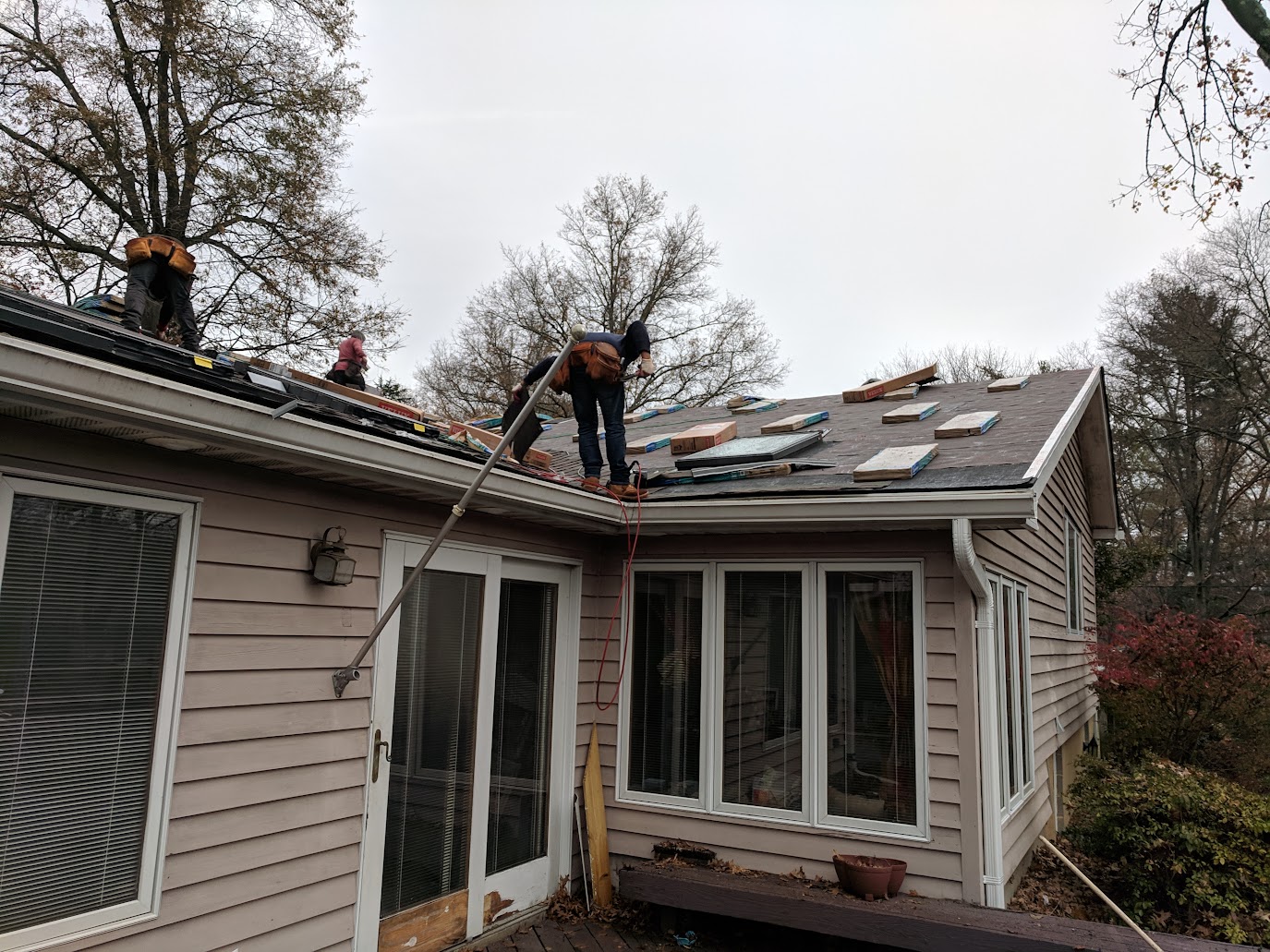 Next Day Roofing crew replacing roof materials at a Columbia, Maryland home